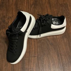 Alexander McQueen shoes. Black with white bottoms.